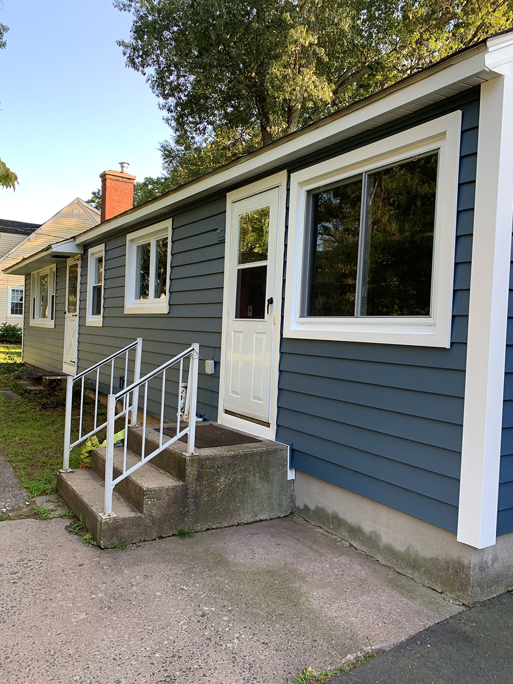 Home with new energy-efficient windows installed by Premier Home Designs LLC